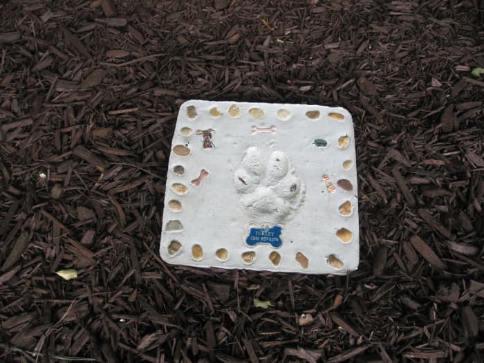 This garden stone, made the day before Turley died, now marks the spot where her ashes are buried.
