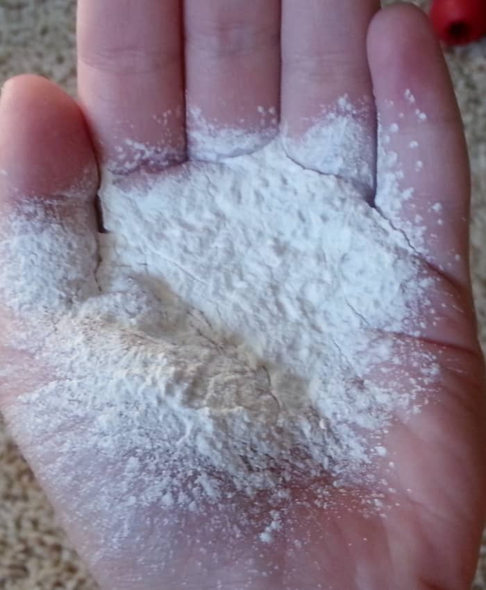 Use cornstarch (baby powder) to stifle the bleeding. Put some in your hand and dip the bleeding nail in it.