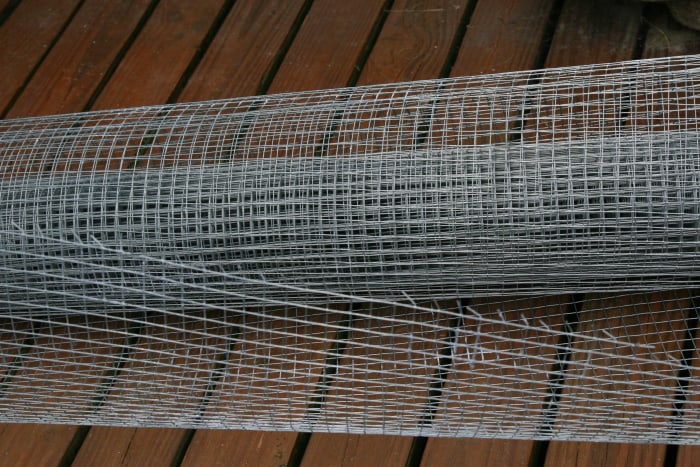 1/2" hardware cloth is much stronger than chicken wire, and will prevent predators from breaking into the coop.