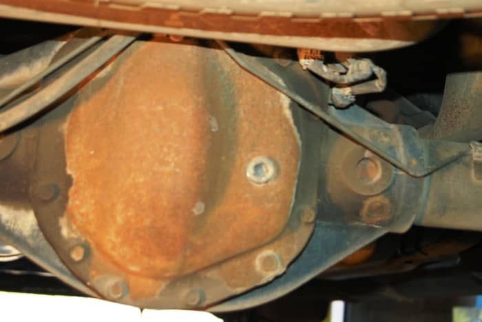 After all the old fluid has drained out, replace the drain plug. Do not over-tighten-it needs to be only snug enough to stop the fluid from leaking out. Go ahead and completely remove the fill plug.