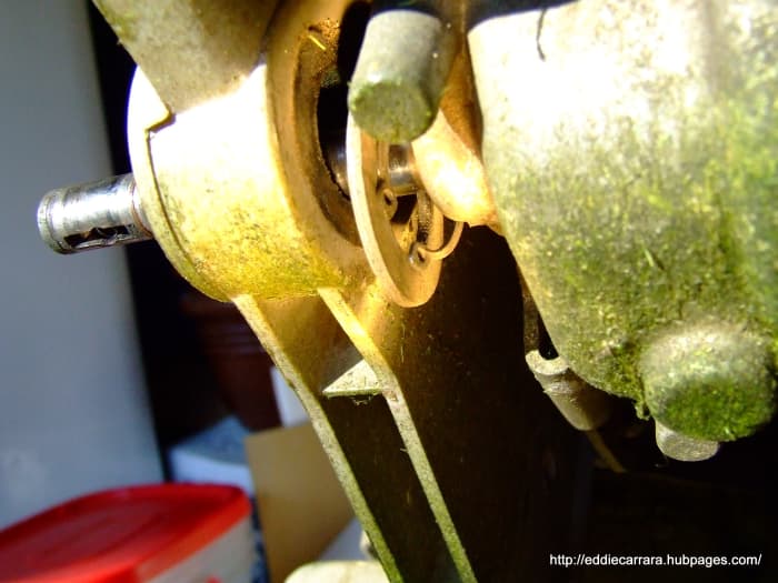 Remove the snap ring on the inside of the wheel adjusters under the mower deck on the Honda Harmony 215 , you may need a set of 90deg snap ring pliers.
