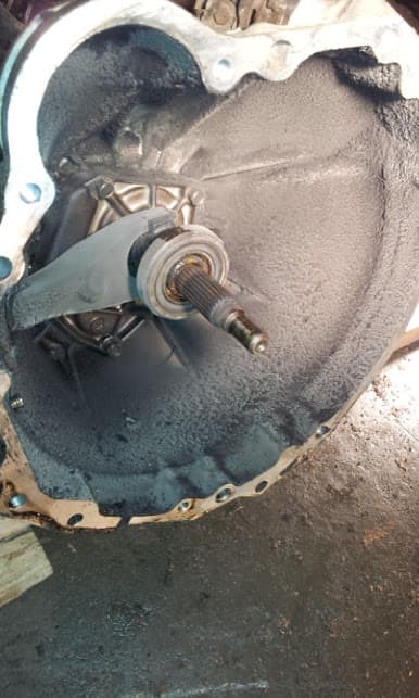 Release bearing on transmission input shaft. All that powder around the bell-housing used to be my clutch friction disc.