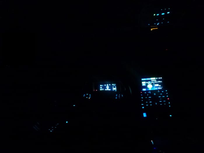 The Chevy volt interior, at night. Taken from the back seat, looking forward through the drivers area.