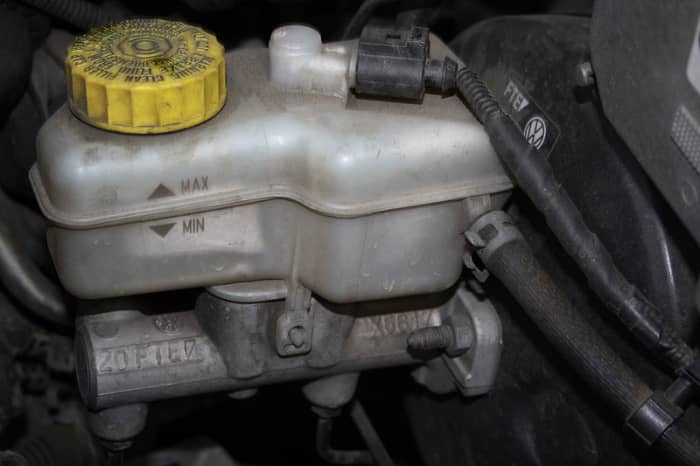 Keep the brake fluid level aove the MIN mark on the reservoir when working and bleeding your brakes.