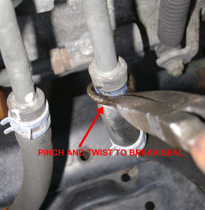 Disconnecting the ATF return line hose with hose pliers