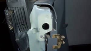 The black hole is missing its hardtop retaining bolt because its support bracket is missing. Make sure they are present when buying a hardtop.