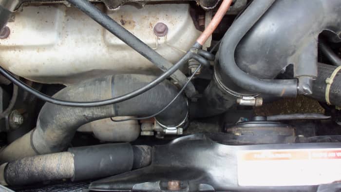 The turbo in a 91-94 Mercury Capri XR2 is low and behind the radiator, it is not located in the throttle area where it says, Turbo.