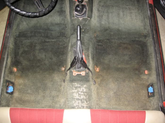 Before shot. The front seats have been removed. Seat belt tongues were masked to keep them shiny.