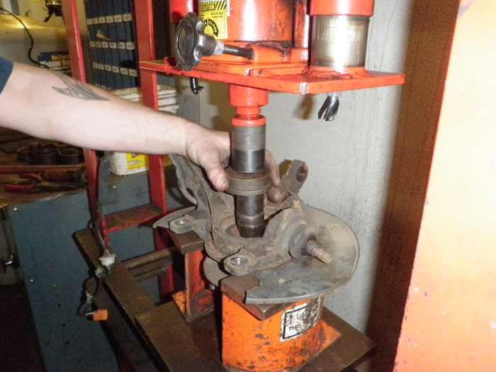 Remove the hub from the center of the bearing.