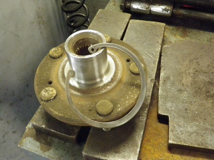 Clean up the snap ring and hub with a wire wheel and a scotchbrite pad or light sand paper.