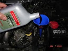 Typically you fill the transmission through the dipstick tube, using a small funnel.