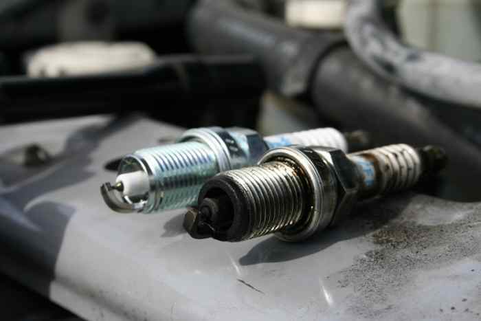 A new spark plug versus an old spark plug. Replace your plugs about every 100,000 miles to keep your vehicle running smooth.