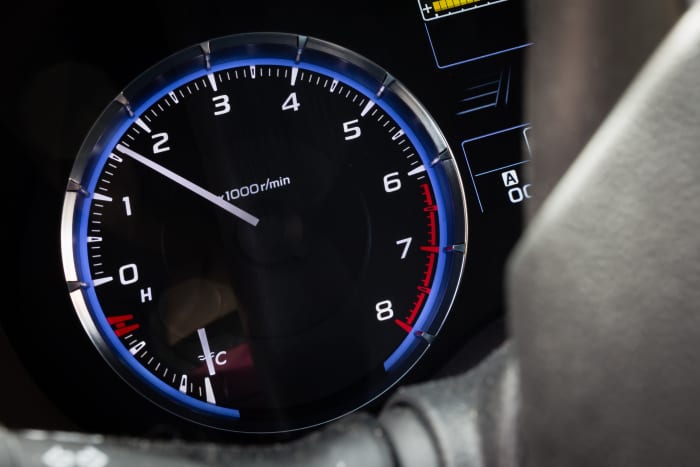 Release the clutch until you feel the car start to roll a bit. Press down on the gas until the needle on your tachometer is between 1000 and 2000 rpm.
