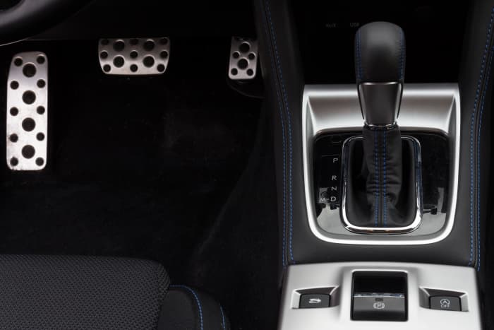 The silver pad on the left of this automatic transmission car is where you can rest your left foot. The brake is in the middle and the accelerator or gas pedal is on the far right.
