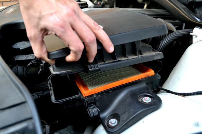 With the clips unlatched, lift the corner of the airbox to reveal the air filter. You can lift the filter up and slide it out.