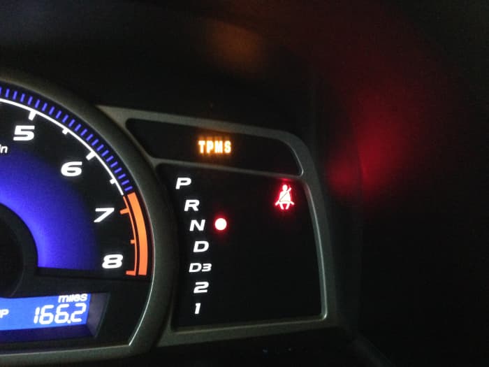 This is a TPMS warning light. It's warning you that there is a problem with your tire pressure monitoring system and you need to have it checked by a professional. Putting air in your tires will not reset this warning light.