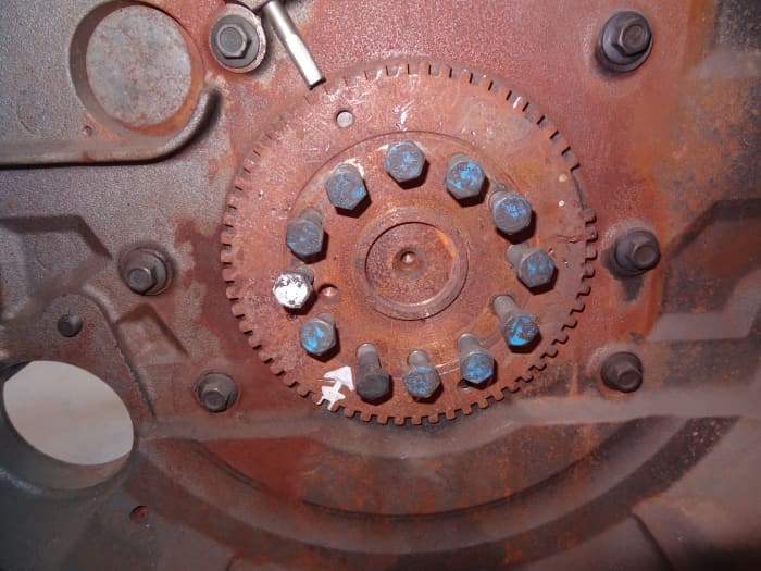 This tone ring and crankshaft position sensor are locate behind the flywheel. The wide notch signals a given engine position.