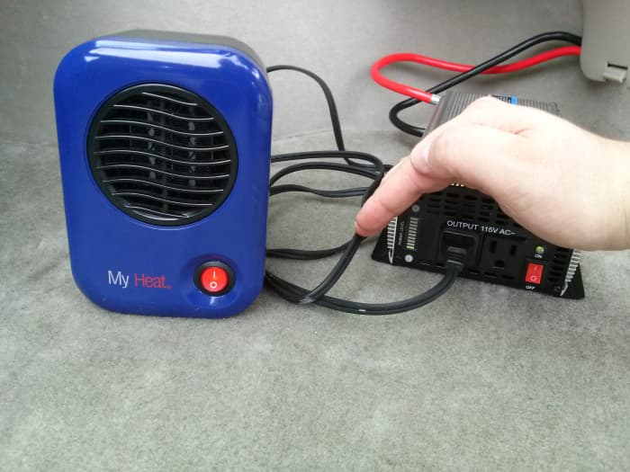 Heater and inverter both turned on and allowed to stabilize for 1 minute. It's hard to see in this photo, but the inverter has a "power level" indicator, which has the bottom-most LED lit up with the heater on. Each LED appears to equal 120 watts.