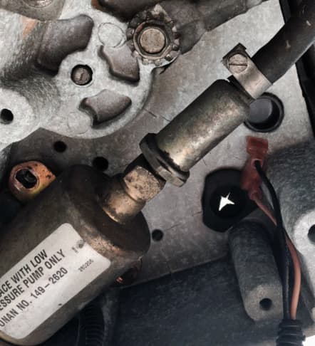 View of the fuel pump and fuel filter on an Onan 5500 RV generator.