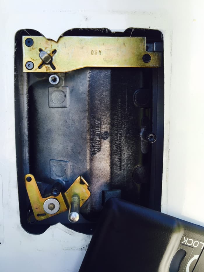 Interior door lock with the cover removed.