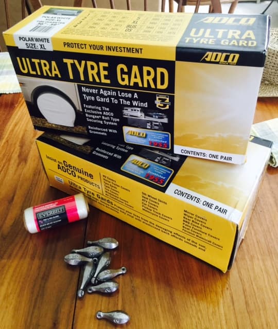 The tire covers and the parts I used to modify mine so that I didn't need to use the bungee straps.