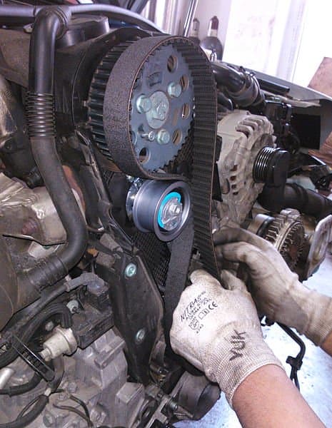 Replace the timing belt if you need to remove it to access the water pump or when it gets contaminated with coolant.