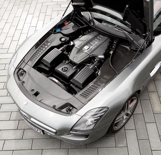 The engine bay of the Mercedes Benz SLS AMG, set back and low, to keep the center of gravity as low as possible in an effort to improve handling.