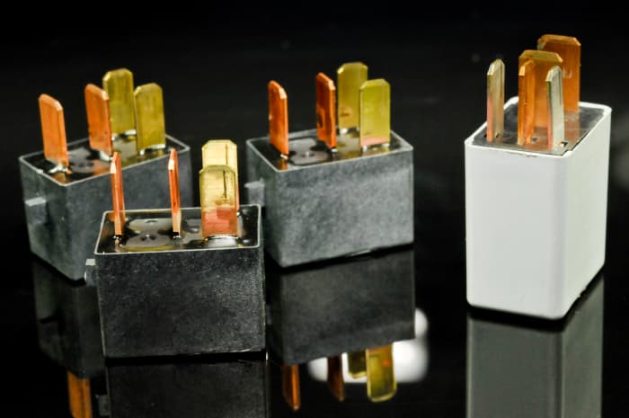 The typical four-prong relay has two circuits: one light-duty control circuit and one heavy duty "load" or "work" circuit.