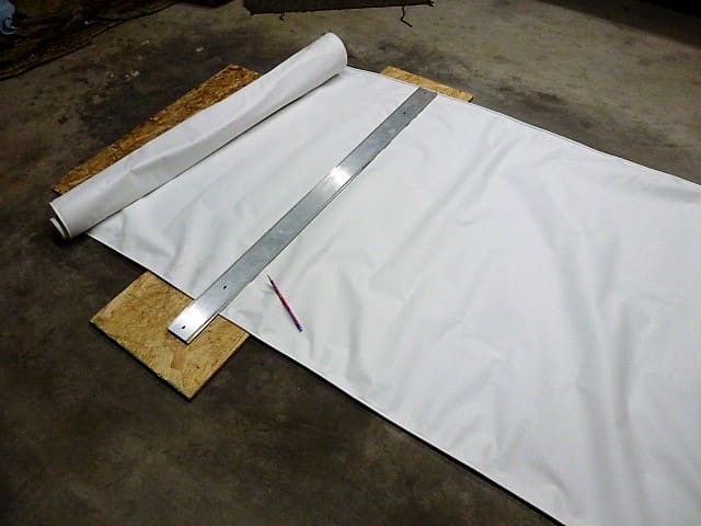 Using a straight edge and pencil to mark the fabric. Make sure the pencil is not so sharp as to poke through the material
