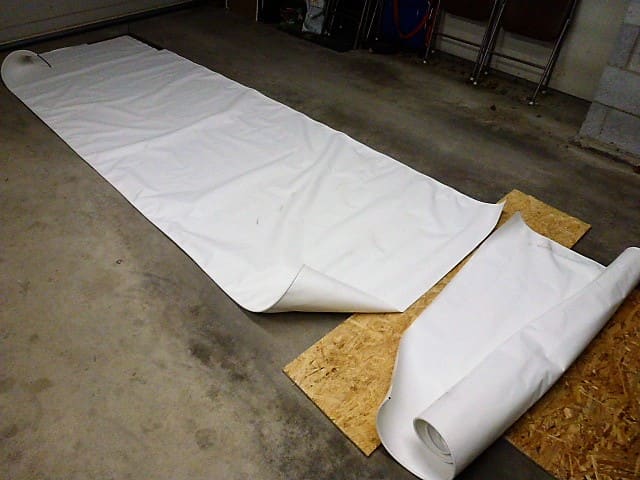 The fabric has been cut, using a box cutter. If a knife is used rather than scissors it is helpful to make the cut on a piece of wood rather than concrete or other surface.