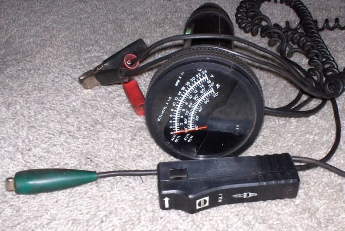 You can use a timing light to help you locate the source of engine noise. This is a timing light with integrated RPM, volt and dwell angle meter.