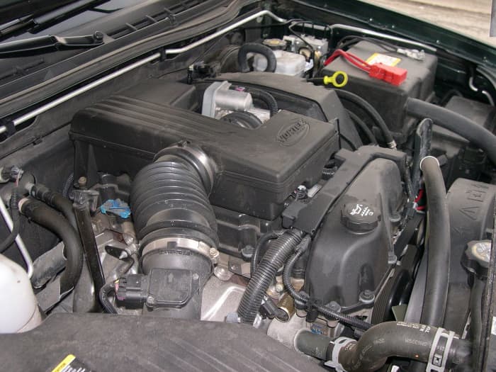 Check the air filter housing and hose between the MAF sensor and throttle body when searching for vacuum leaks.