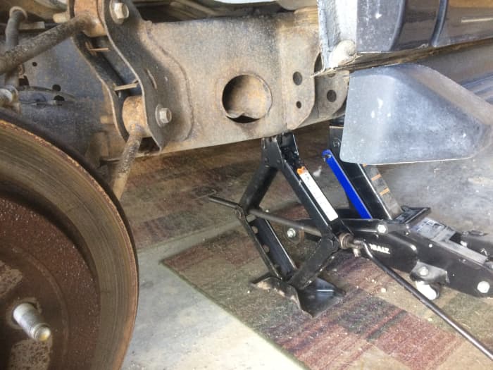 Your car may come with a jack, which works well enough, but for added security, a jack stand is recommended.