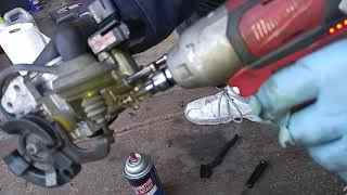 Removing the Toyota 5SFE idle air control valve from the throttle body for cleaning