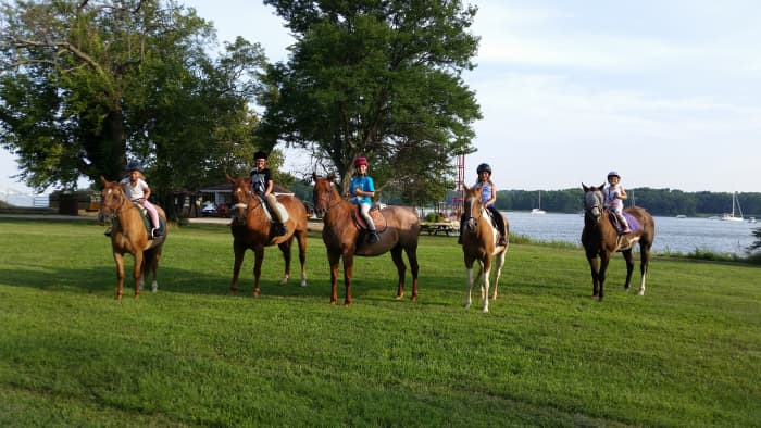 Posing for a picture on grass was a challenge for lesson-ponies and kids used to schooling in a sand arena!