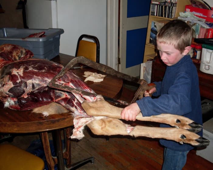 The cut is made in this location because there is no meat to speak of. Also, this provides cartilage for your dog to chew along with the bone.