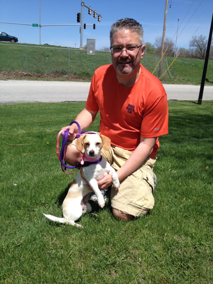 My husband and one of the dogs we transported at Cracker Barrel, one of our meeting places for transports.