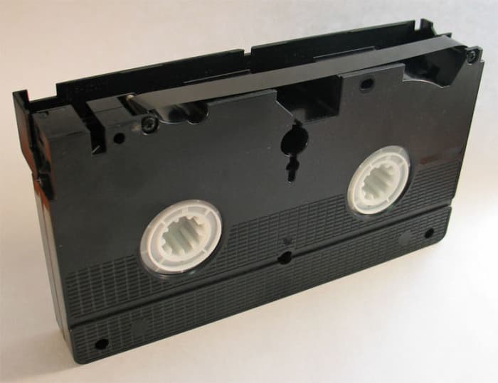 Exposing the magnetic strip. VHS tapes are very durable as long as you don't damage the magnetic strip!