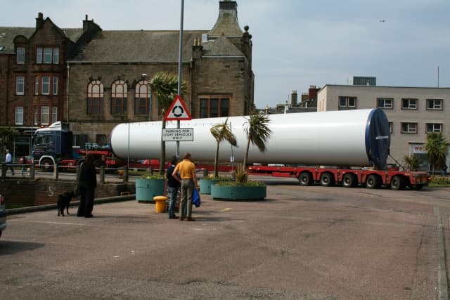 A long vehicle maneuvering city streets in Campbeltown, Scotland