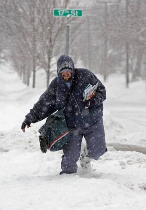 So you think you're ready to brave the elements? Good luck trying to talk your boss out of it. Here Mailman Bill Margo trudges though deep snow in Cuyahoga Falls, Ohio.