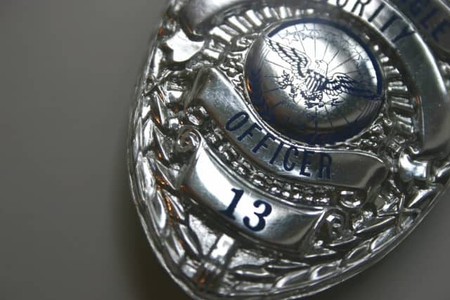 The badge is symbolic of job function and role, identifying the law enforcement officer as legit.