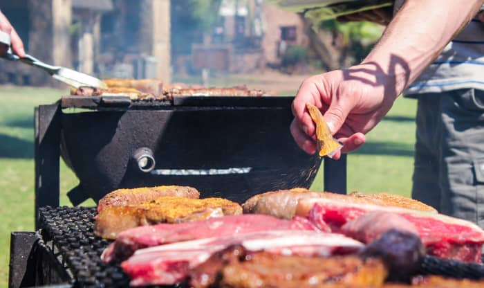 Standing in as the barbecue chef will let you meet a lot of people as they go through the food line, but the good news is that you won't have to talk to any one person for too long.