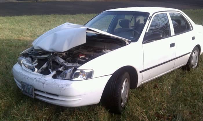 This car went through a hedge and was probably declared a total loss. Used parts and no paint would get this back on the road cheap and ugly—with the rest of the insurance money in hand.