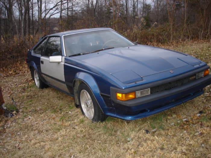 The car is about 25 years old. The owner decided a used door from another car was fine and he isn't picky about paint color. It gets him around town just fine in this condition.