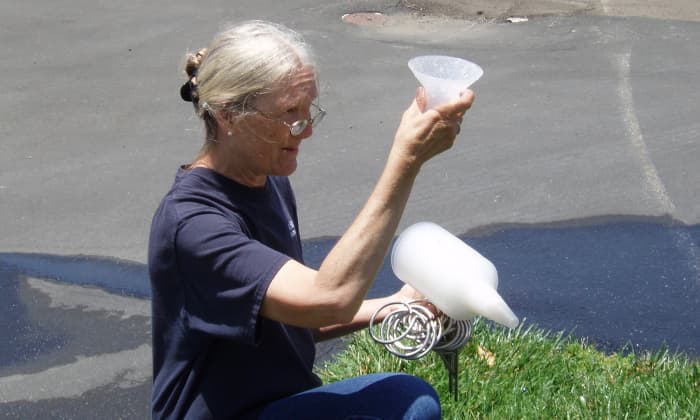 Here we are conducting a catch can test, which determines how evenly the sprinklers are spraying. It's standard procedure to conduct one, but not all do. If your people do, be sure to mention it.