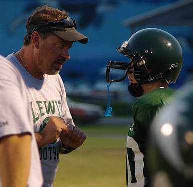 This coach is intense, but not tense, as he works to get his point across.
