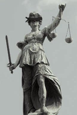 The blindfold over the eyes of Lady Justice symbolizes disinterest - the lack of bias - a critical factor in self-evaluation.