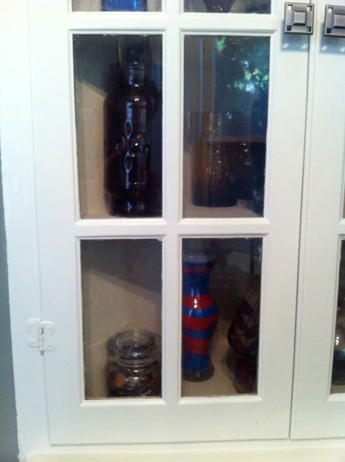 The coin jar is nicely tucked away inside of a cabinet. Don't leave it exposed for someone to spend or steal it.