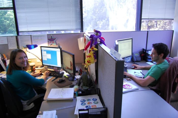There's no way you can carry on a private conversation when you have a co-worker sitting a few feet away. Get used to it. Courteous co-workers pretend they are not listening.