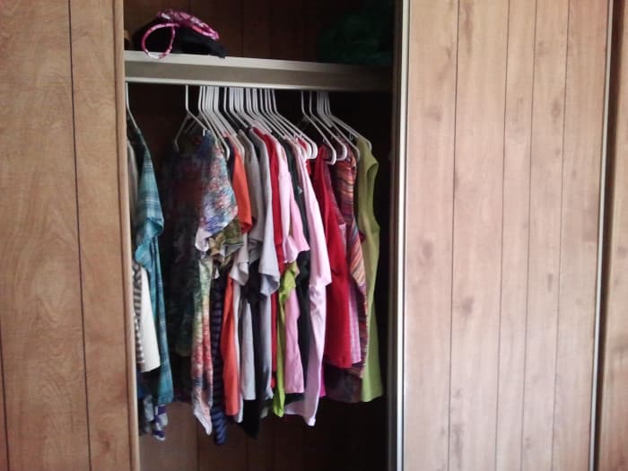 My house may be short on aesthetics, but it's long on storage space. I have a total of 20 kitchen cabinets and four of these huge closets—you're only seeing one side of it open here.